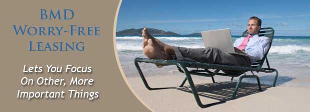 Campaign manager on beach with laptop